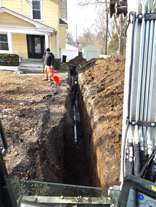 Sewer line trench dug in front of a Kansas City home